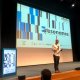 Conference stage with speaker Paulo